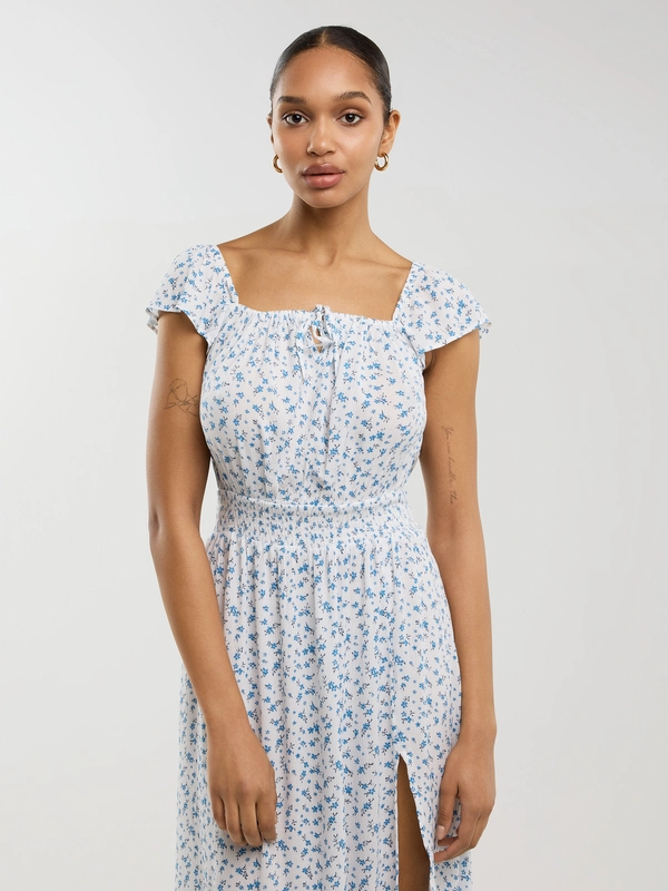 Sukienka damska midi z wiskozy z motywem kwiatowym biała Lopa 100