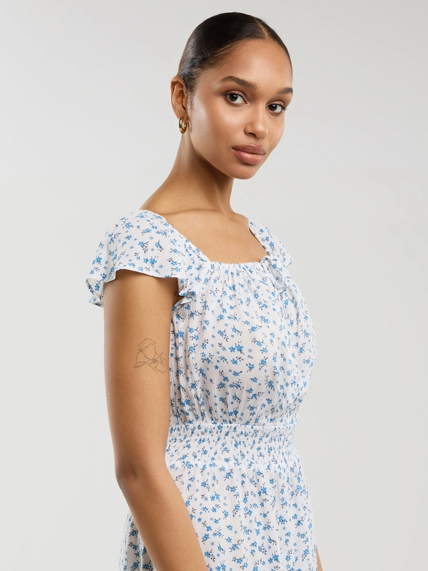 Sukienka damska midi z wiskozy z motywem kwiatowym biała Lopa 100