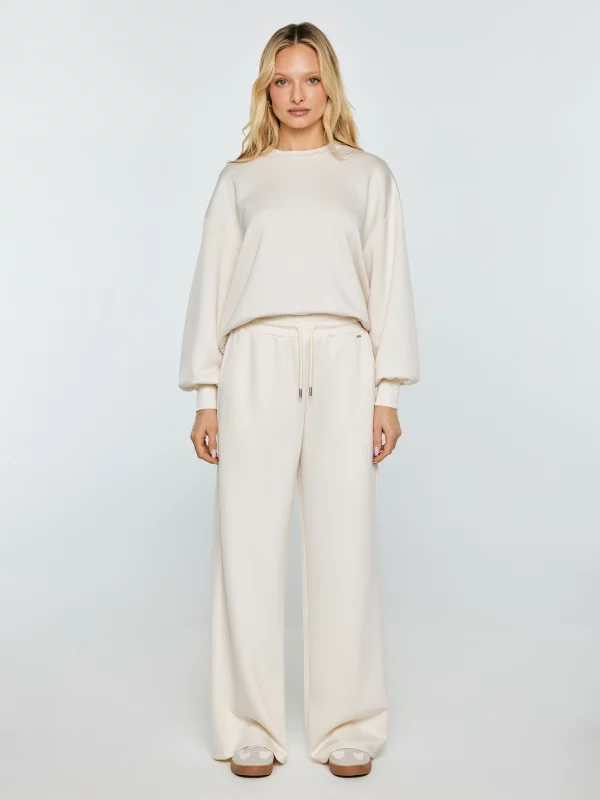 Spodnie damskie dresowe z szeroką nogawką kremowe Lunarap 102